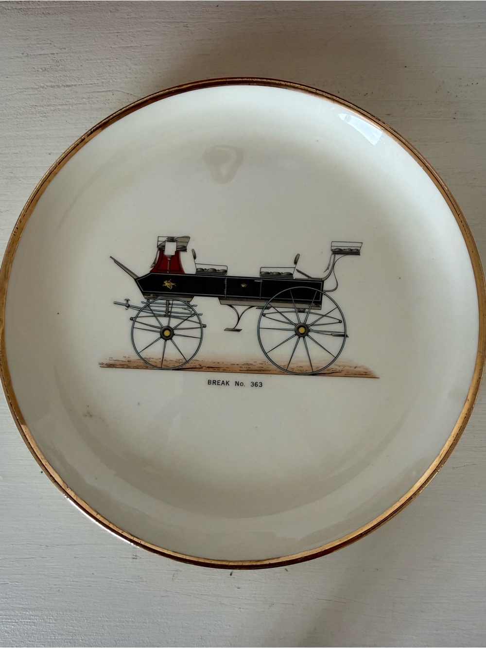Vintage Decorative White Porcelain Plate with Black Carriage Motif and Gold Rim